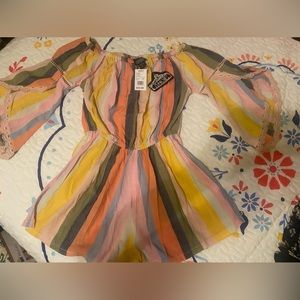 Juniors size large, multi color romper. Brand new with tags
